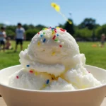 Snow ice cream recipe with fresh snow, milk, sugar, and vanilla, topped with chocolate chips and served in a bowl