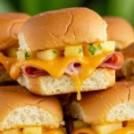 Golden, cheesy Hawaiian Ham and Cheese Sliders Recipe fresh out of the oven, perfect for parties and gatherings.